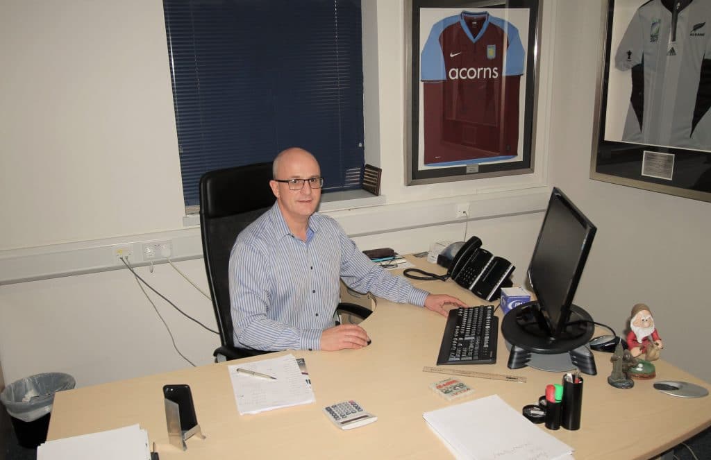 Andy Bullingham director of JPM at his desk