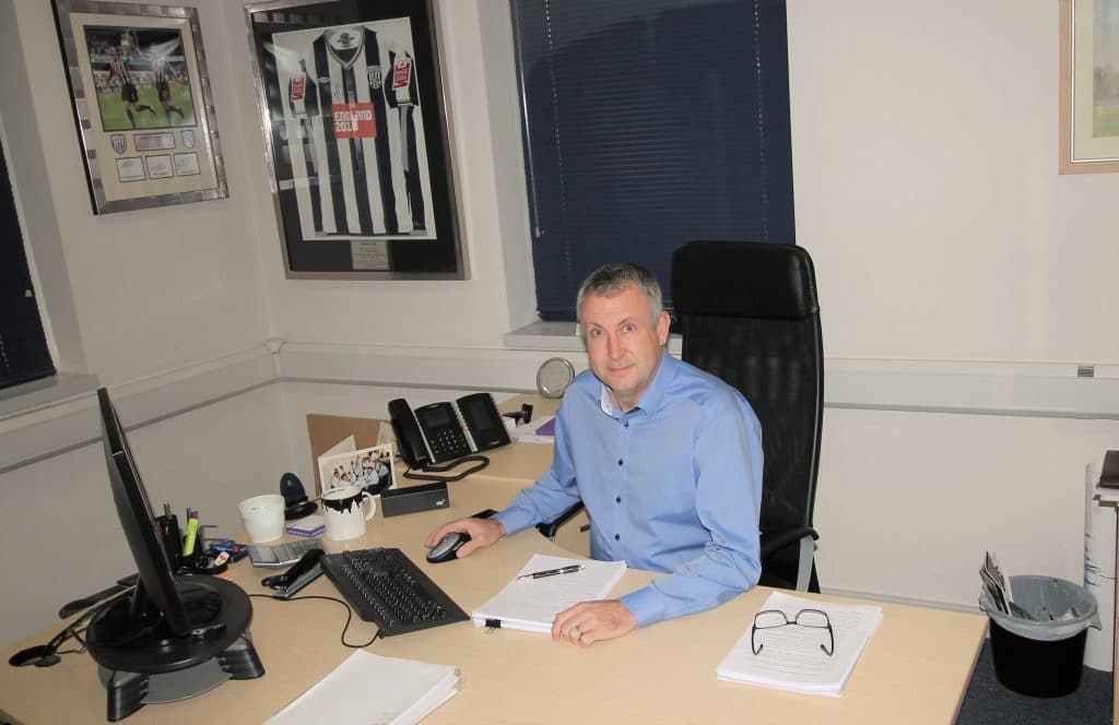 Andrew Windsor director of JPM at his desk