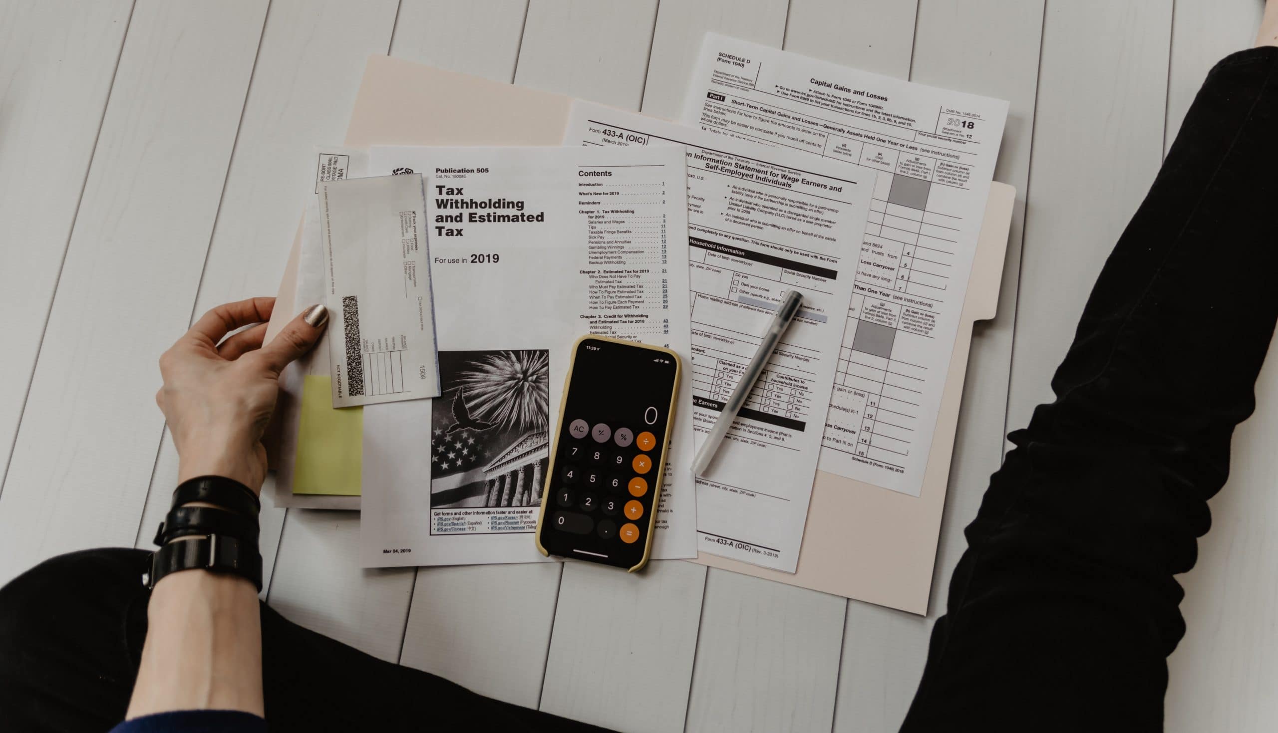kelly-sikkema-xoU52jUVUXA-unsplash Tax forms